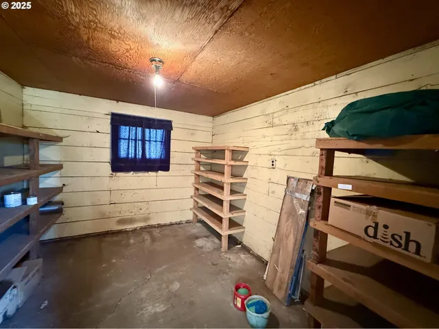 a view of a patio with table and chairs