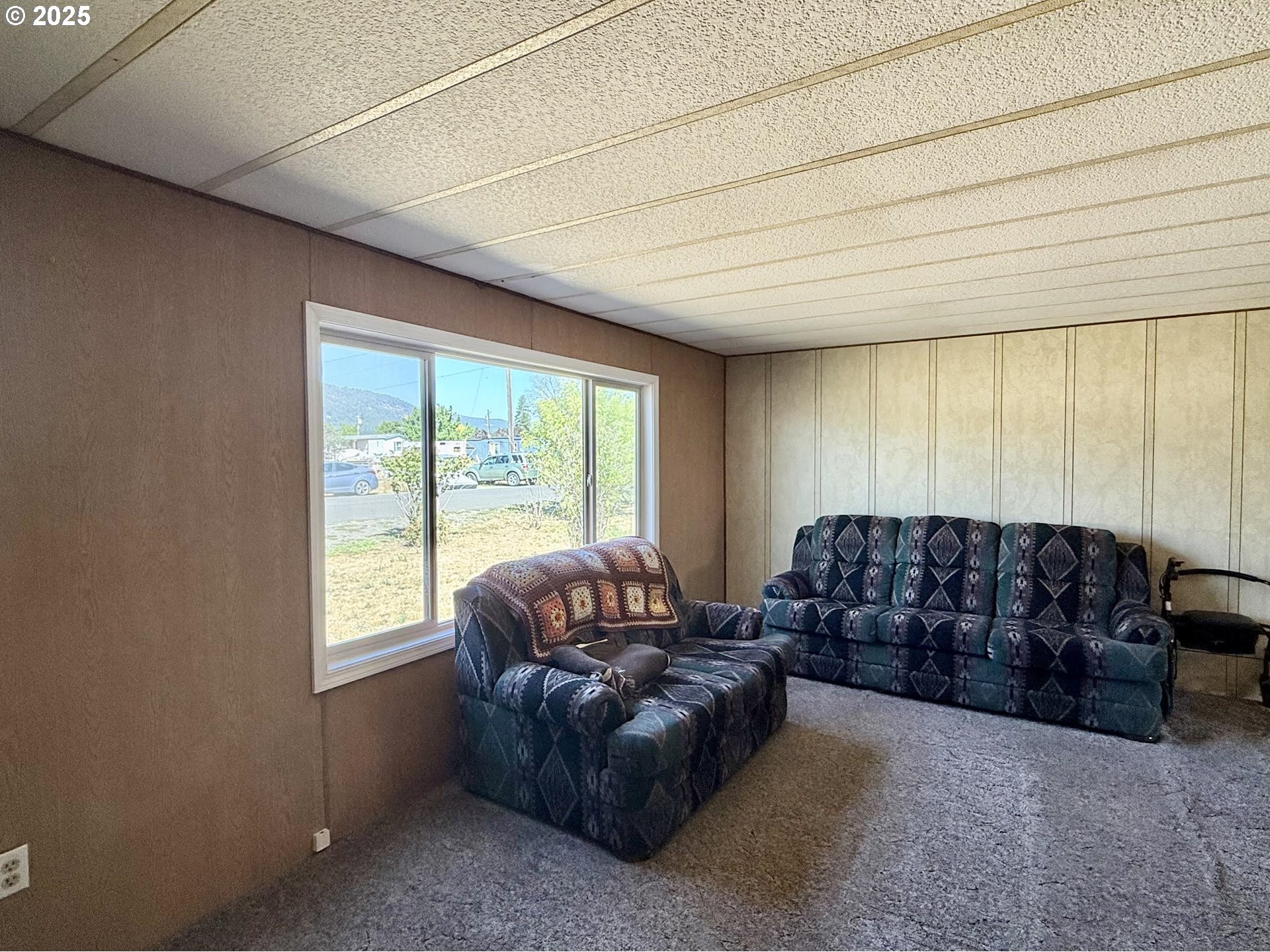 505 North 16th Avenue Elgin, OR 97827 - Photo 5 of 48 a living room with a couch and a large window