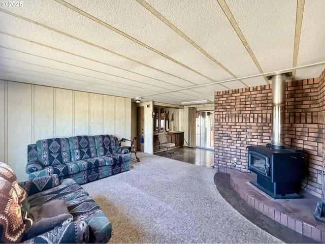 a living room with furniture window and couch
