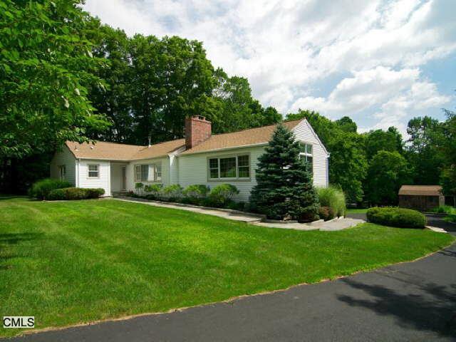 10 Ridgebury Road Ridgefield, CT 06877 - Photo 1 of 1 a front view of a house with a yard
