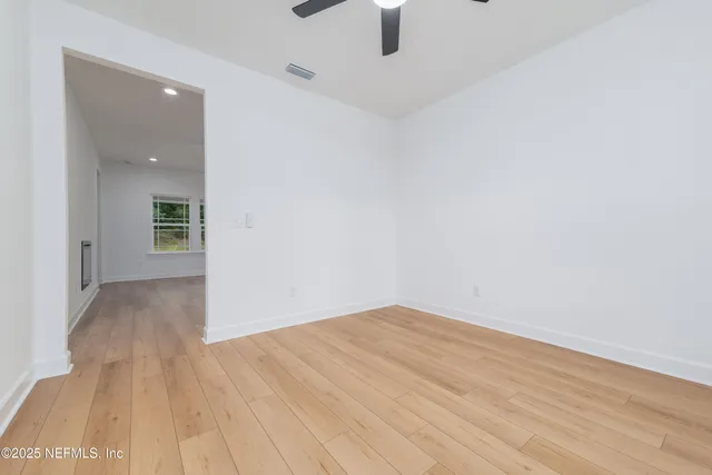 wooden floor in a hall with an entryway