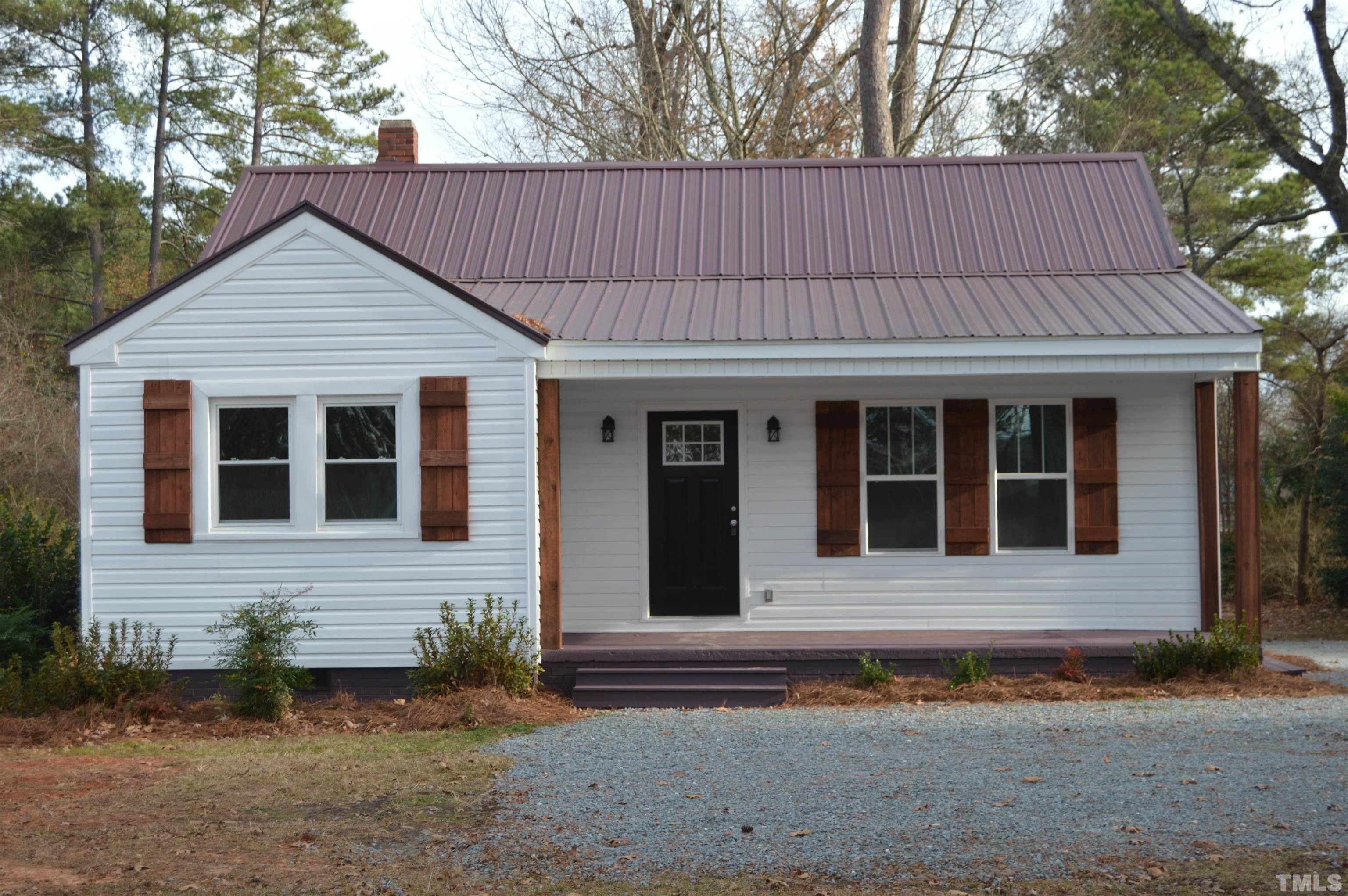 2123 Carthage Street Sanford, NC 27330 - Photo 1 of 18 a front view of a house having yard
