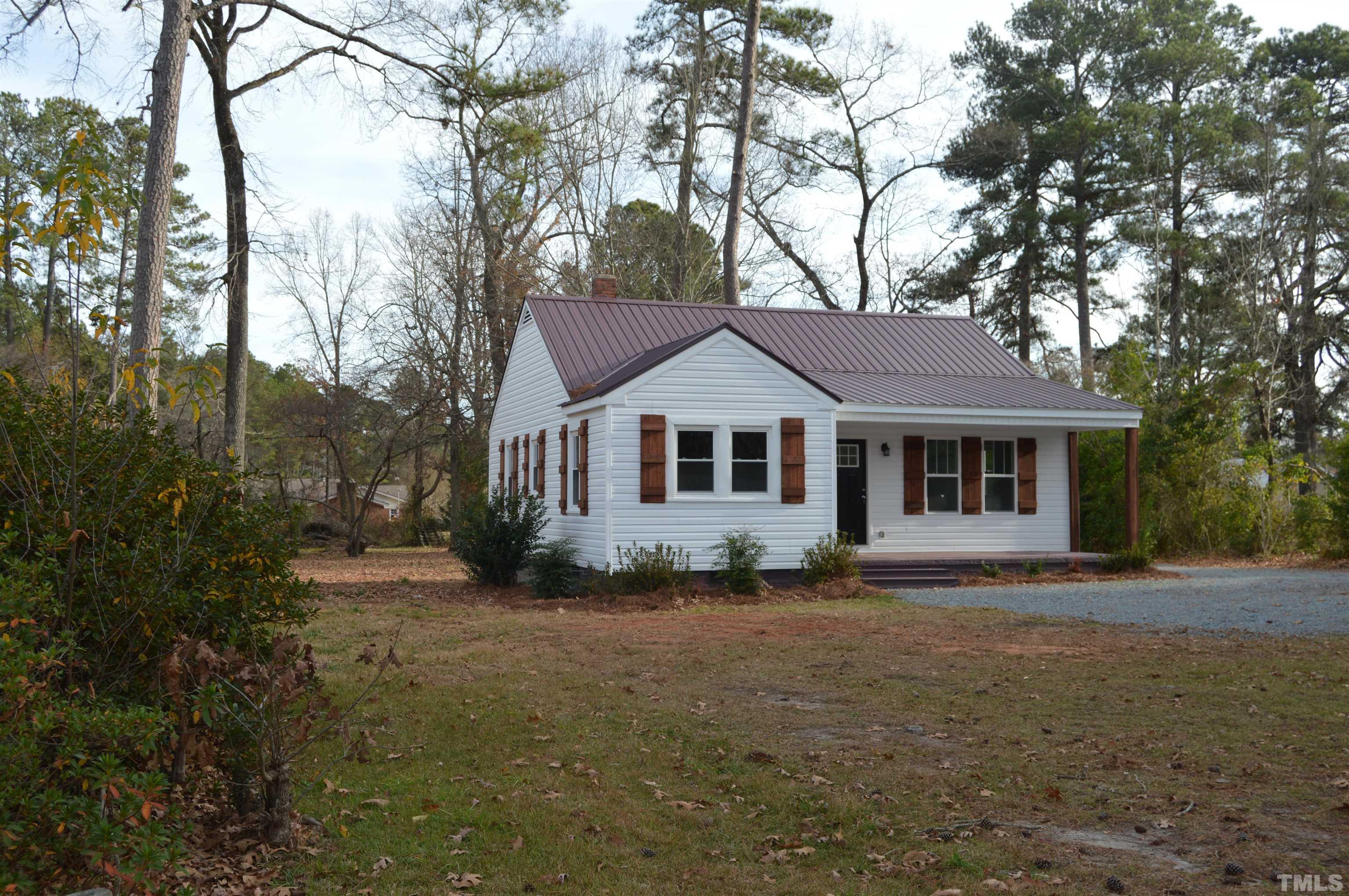 2123 Carthage Street Sanford, NC 27330 - Photo 2 of 18 a view of a house with a yard