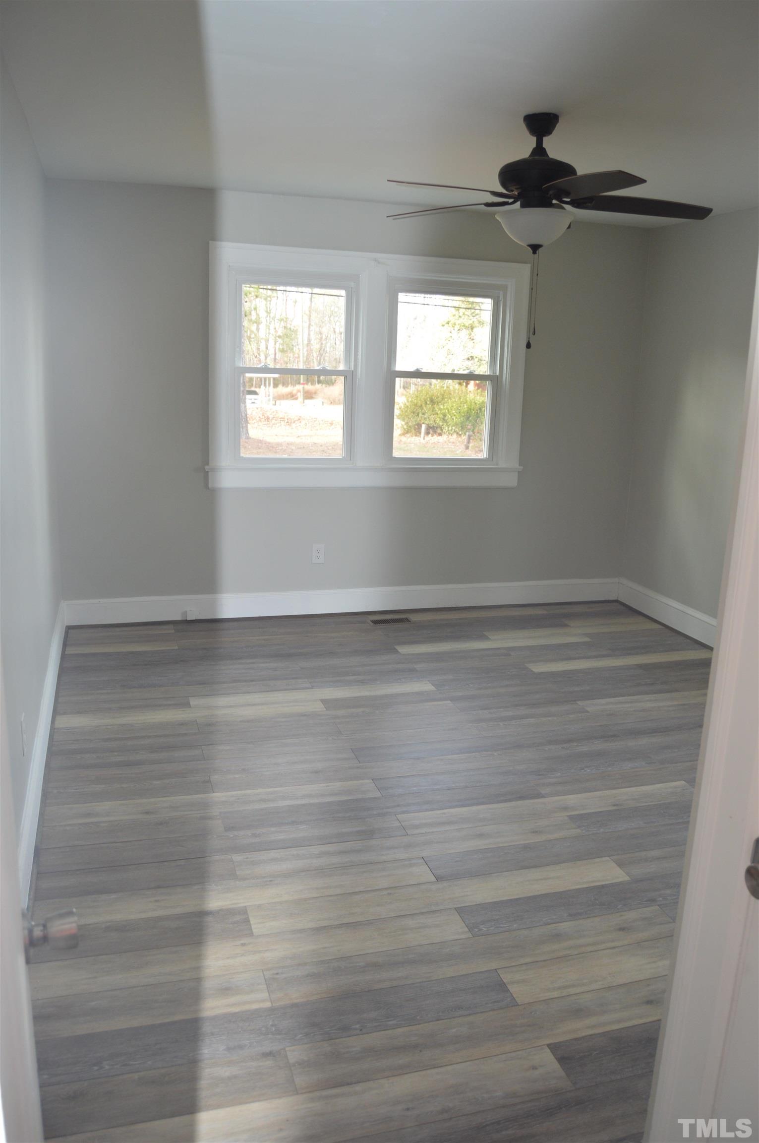 2123 Carthage Street Sanford, NC 27330 - Photo 12 of 18 a view of an empty room with a window