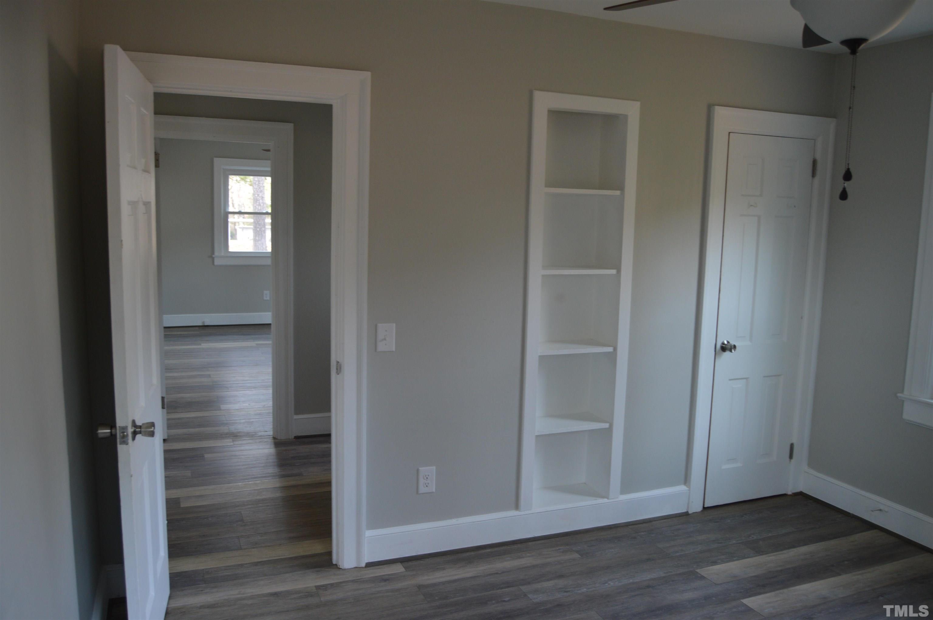 2123 Carthage Street Sanford, NC 27330 - Photo 13 of 18 a view of empty room with wooden floor
