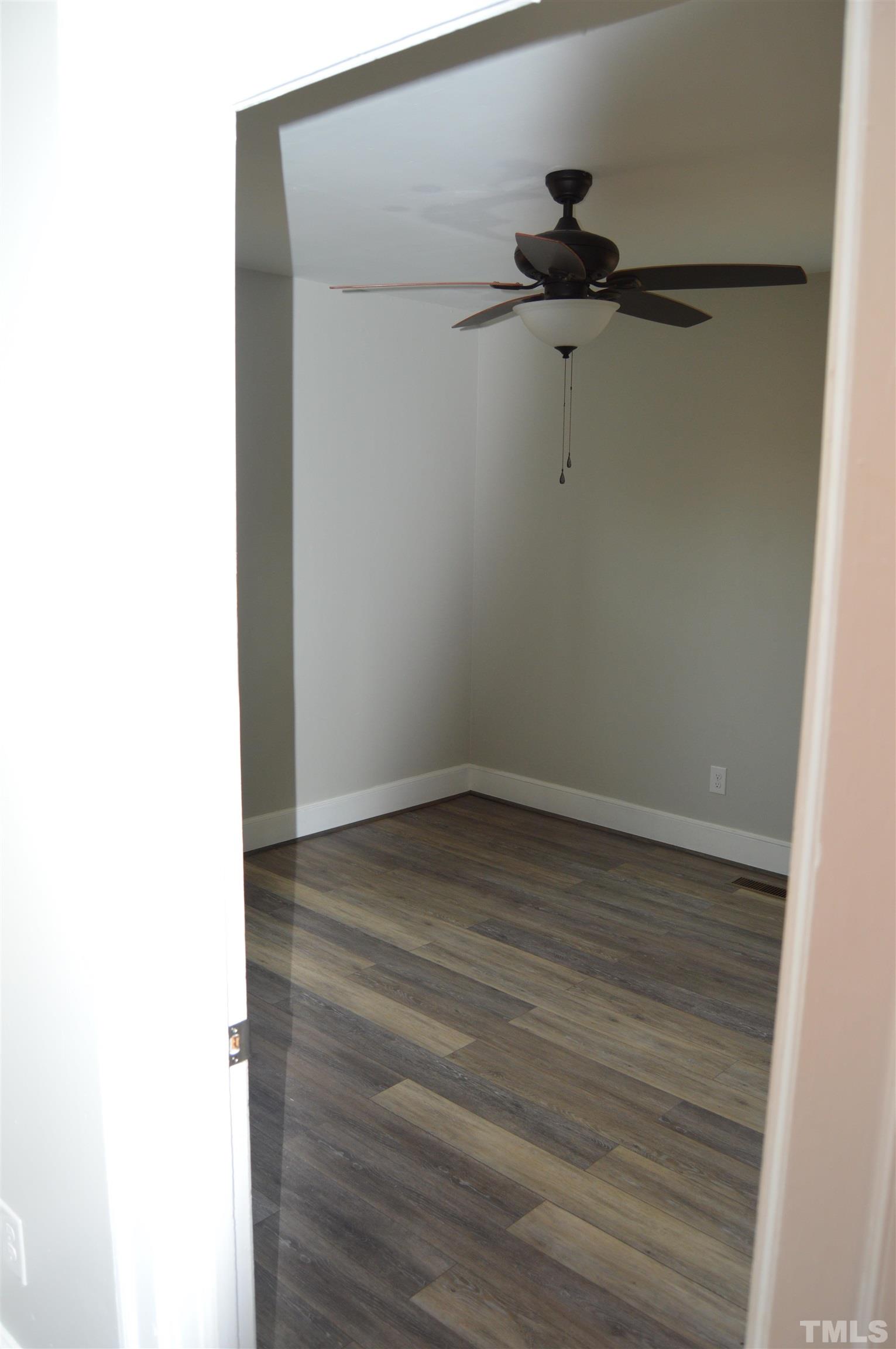 2123 Carthage Street Sanford, NC 27330 - Photo 14 of 18 a view of a room with wooden floor