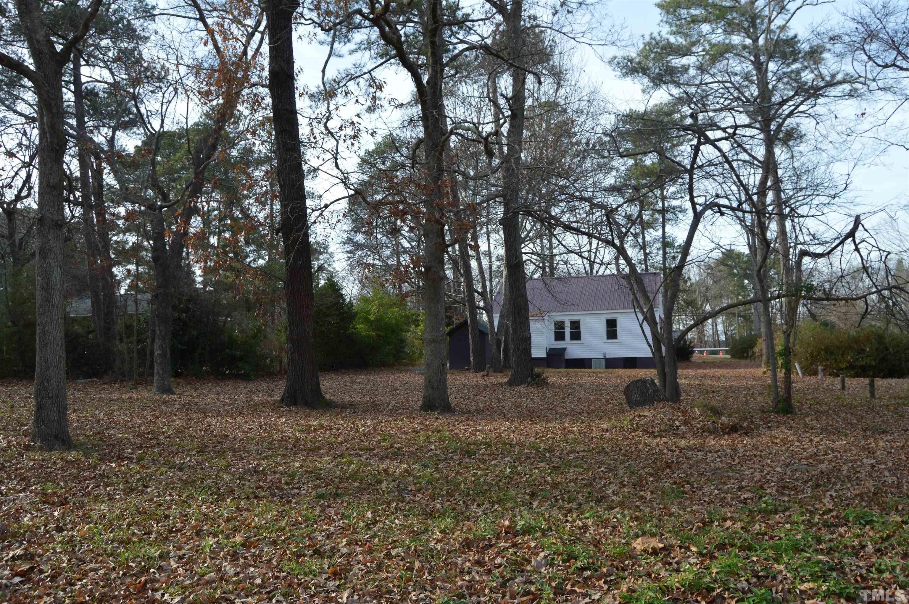 2123 Carthage Street Sanford, NC 27330 - Photo 8 of 18 a backyard of a house with lots of green space