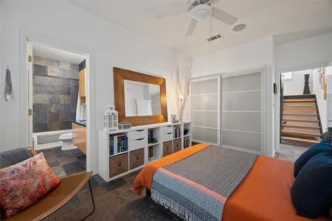 a bedroom with bed and a window