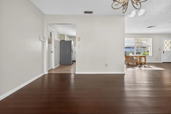 a view of a livingroom with wooden floor