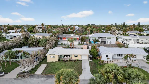 an aerial view of a house with outdoor space