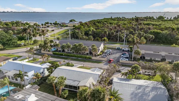 an aerial view of houses with yard