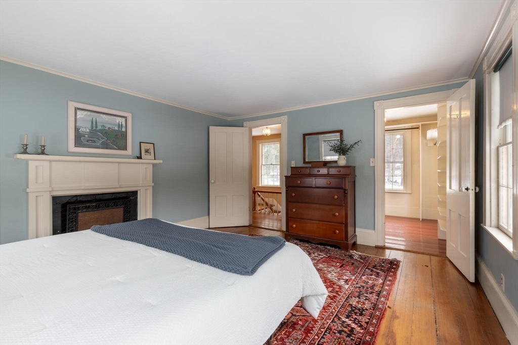 520 Dutton Road Sudbury, MA 01776 - Photo 30 of 42 a bedroom with a bed and a television