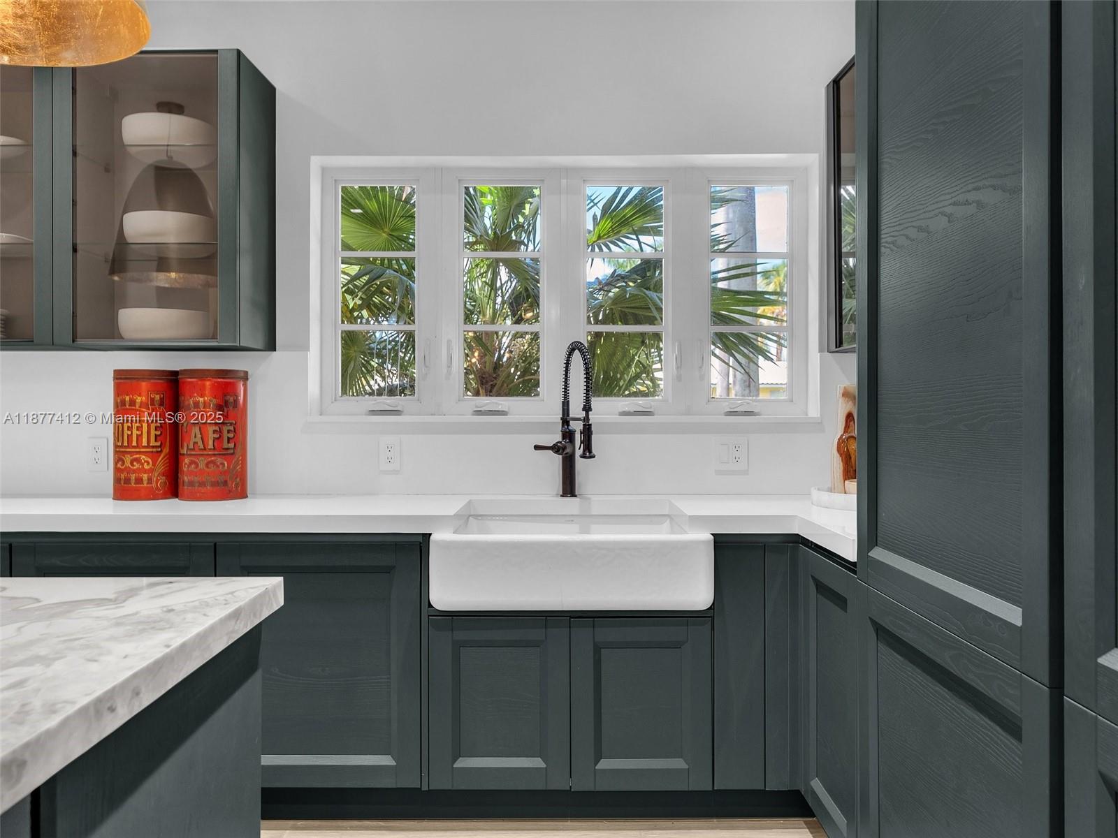 856 Tyler Street Hollywood, FL 33019 - Photo 20 of 52 a sink sitting next to a window