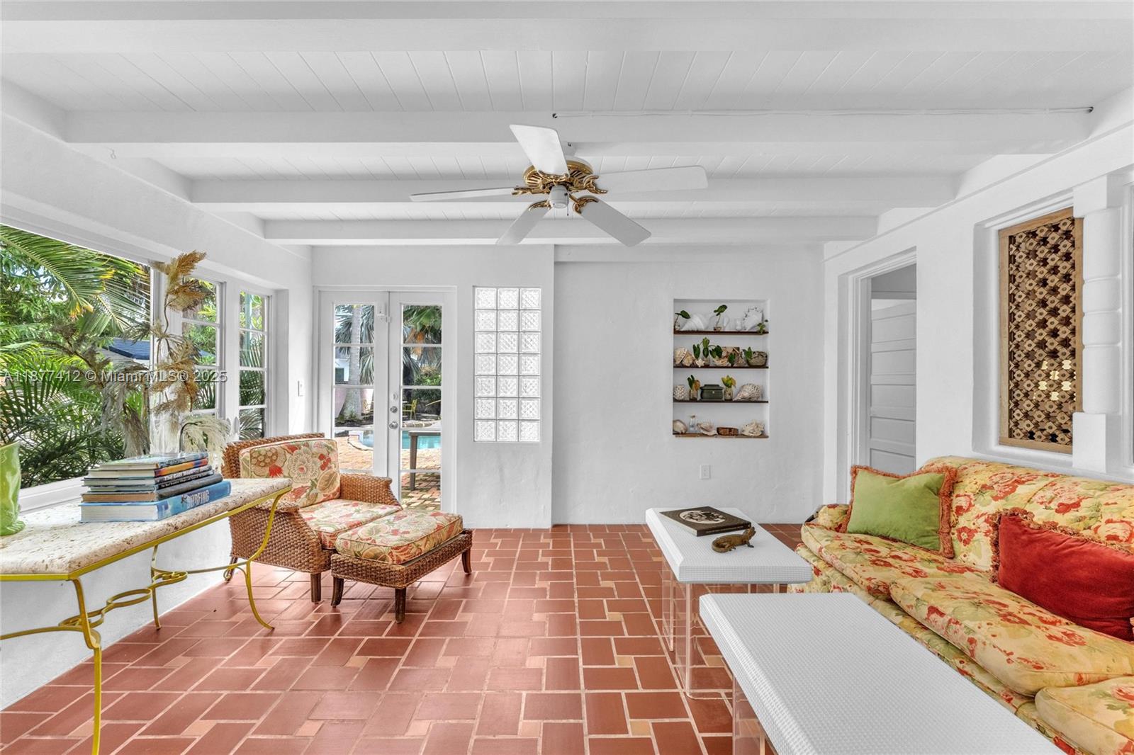 856 Tyler Street Hollywood, FL 33019 - Photo 23 of 52 a living room with furniture and a large window