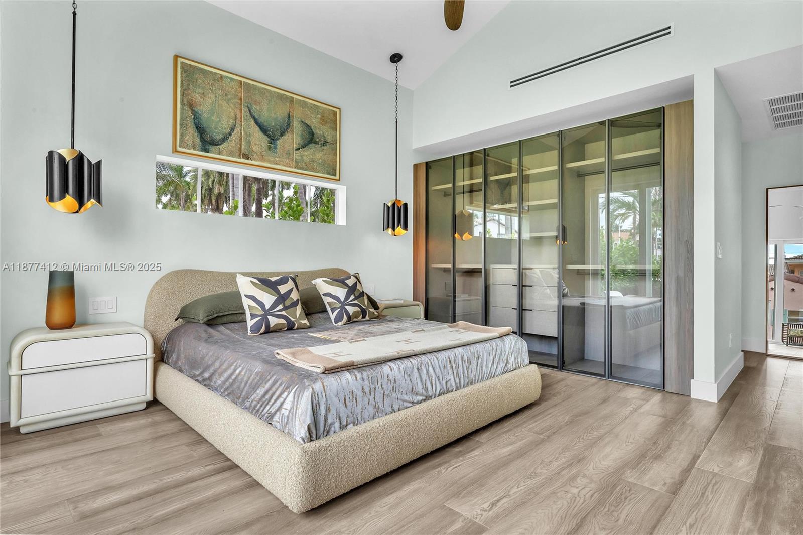 856 Tyler Street Hollywood, FL 33019 - Photo 27 of 52 a bedroom with a large bed and a window