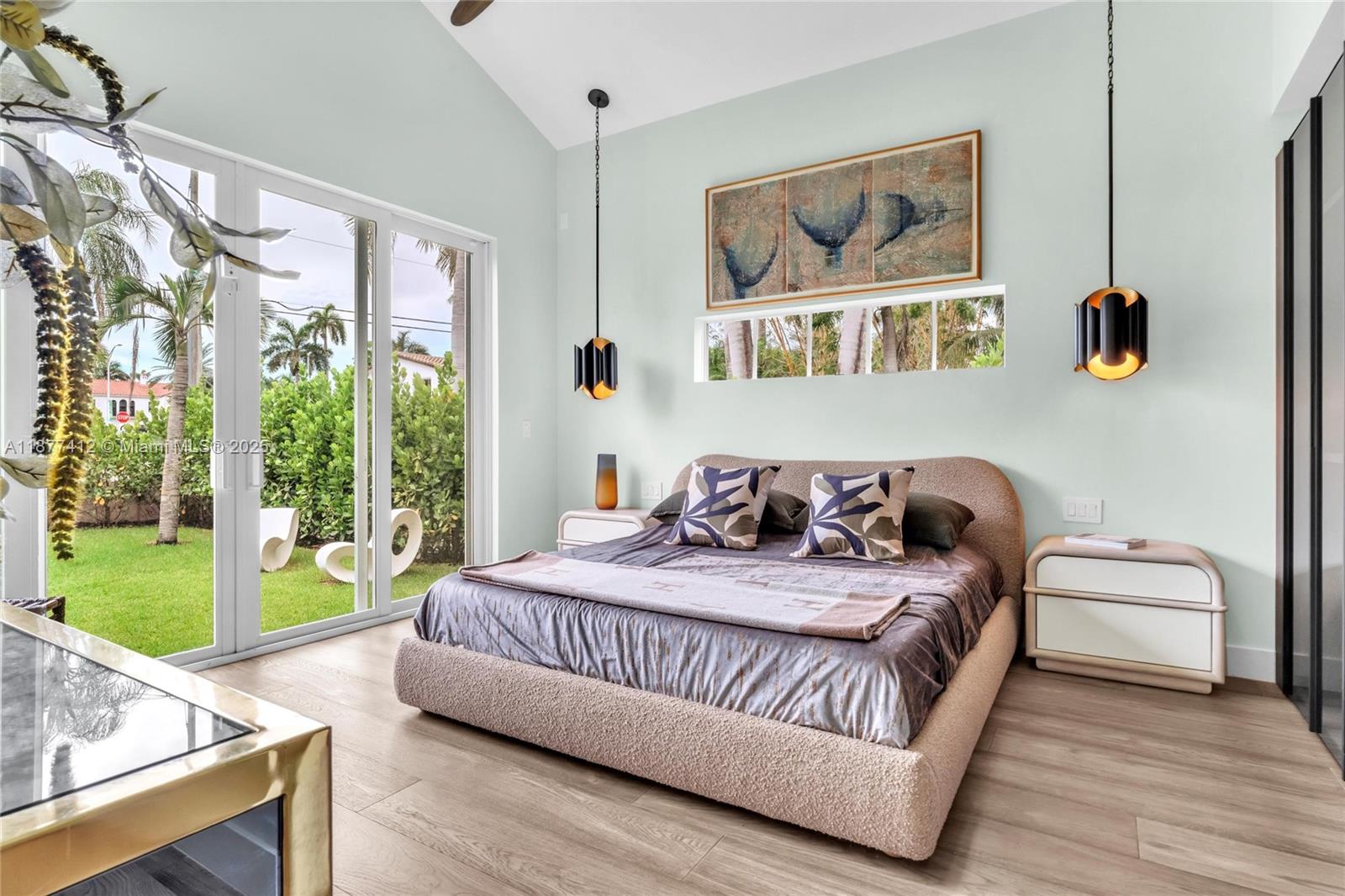 856 Tyler Street Hollywood, FL 33019 - Photo 28 of 52 a bedroom with a bed and a window