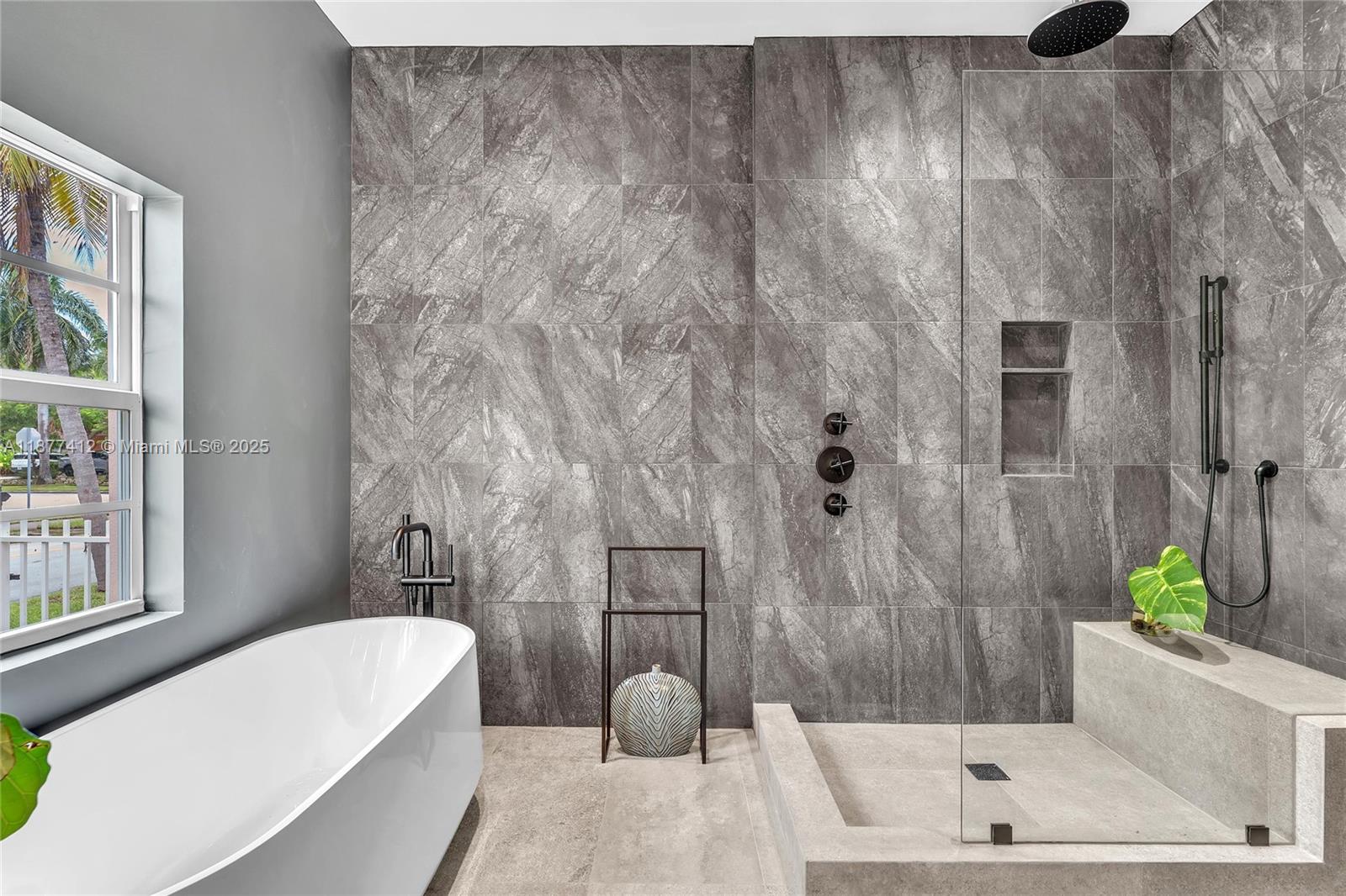 856 Tyler Street Hollywood, FL 33019 - Photo 33 of 52 a bathroom with a sink and a bathtub