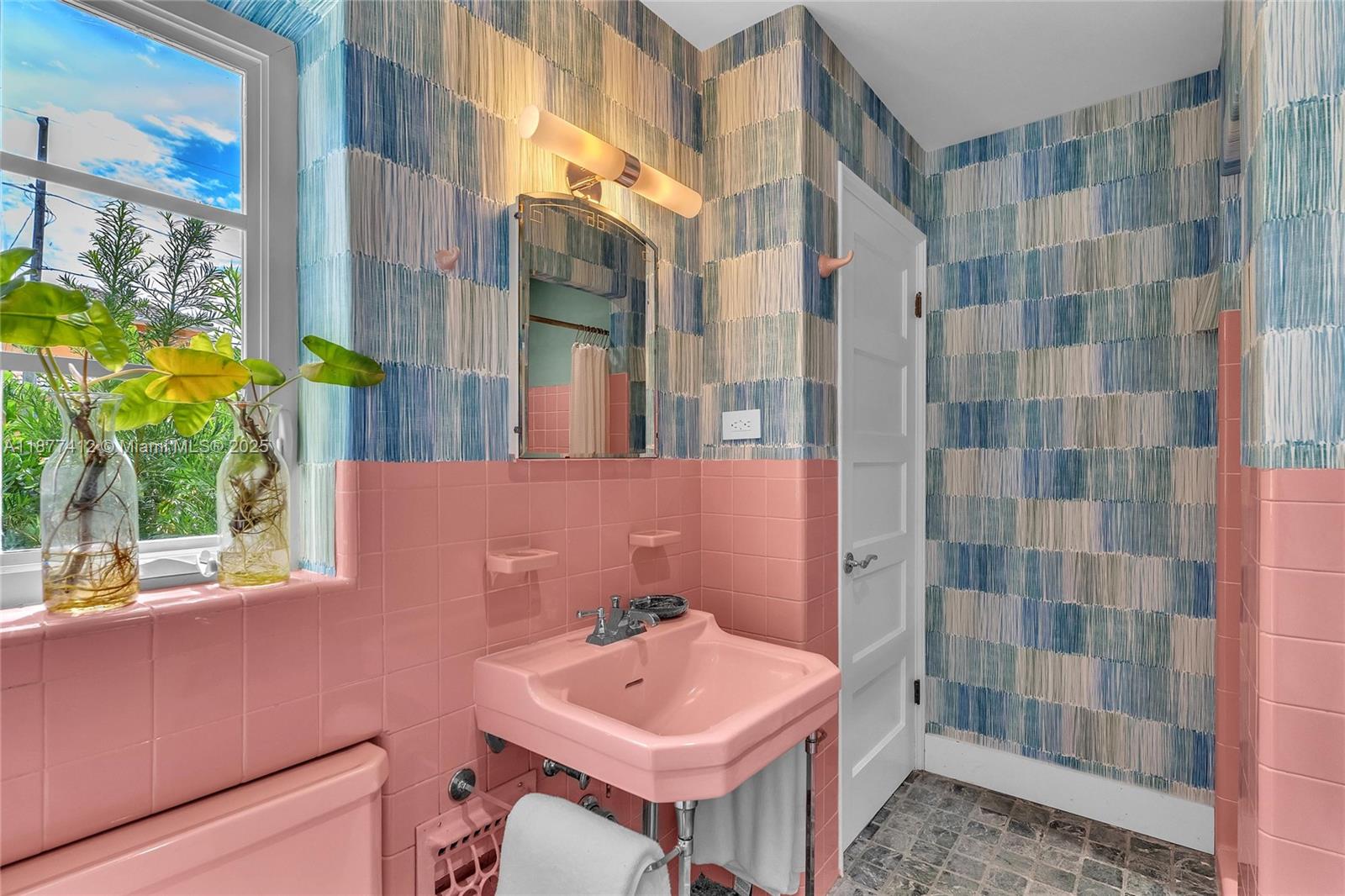 856 Tyler Street Hollywood, FL 33019 - Photo 45 of 52 a bathroom with a sink toilet and shower