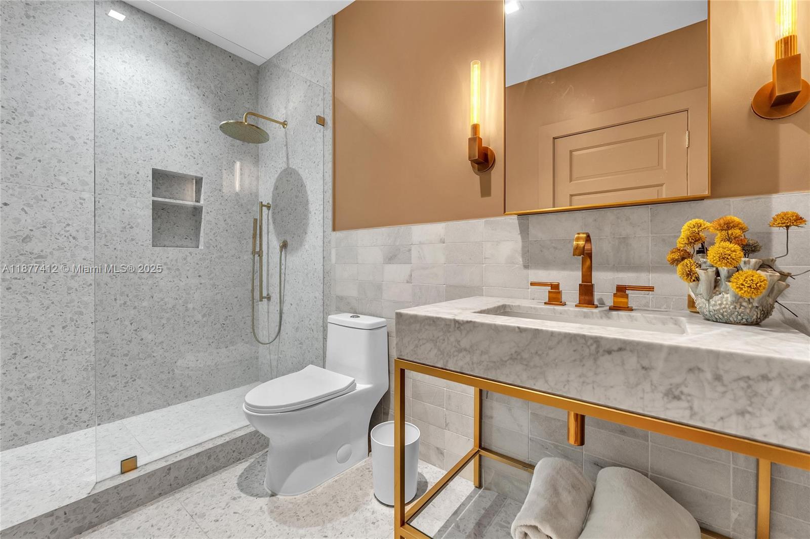 856 Tyler Street Hollywood, FL 33019 - Photo 48 of 52 a bathroom with a granite countertop sink and a toilet