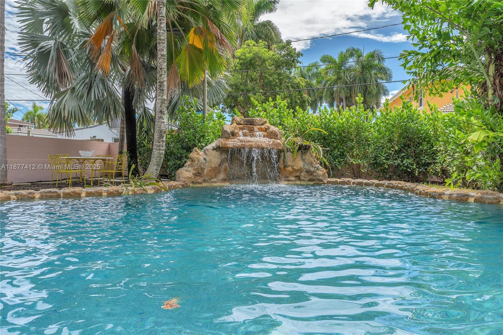 856 Tyler Street Hollywood, FL 33019 - Photo 52 of 52 a backyard of a house with lots of green space