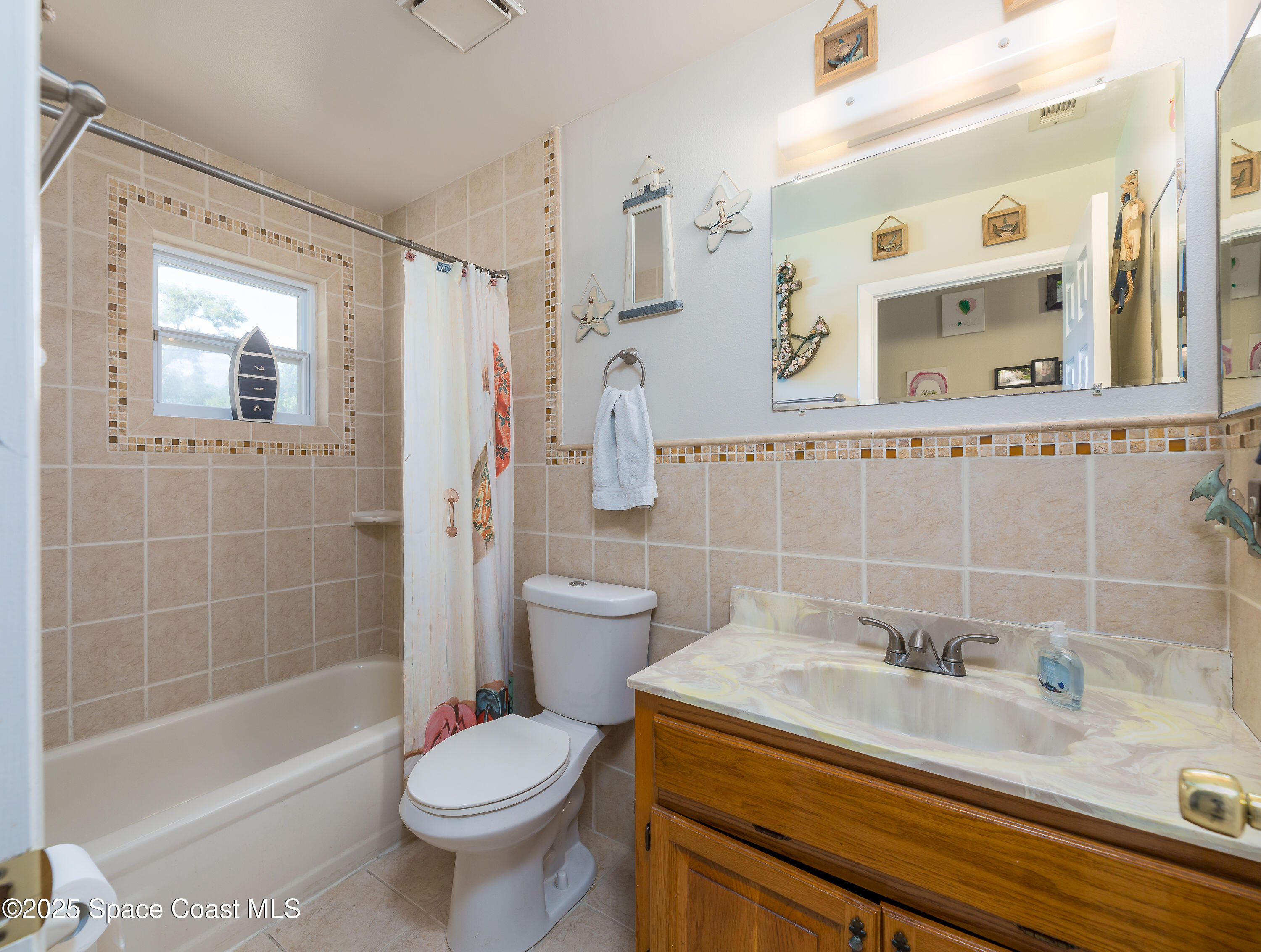 1135 Audubon Road Merritt Island, FL 32953 - Photo 24 of 52 a bathroom with a sink toilet and shower