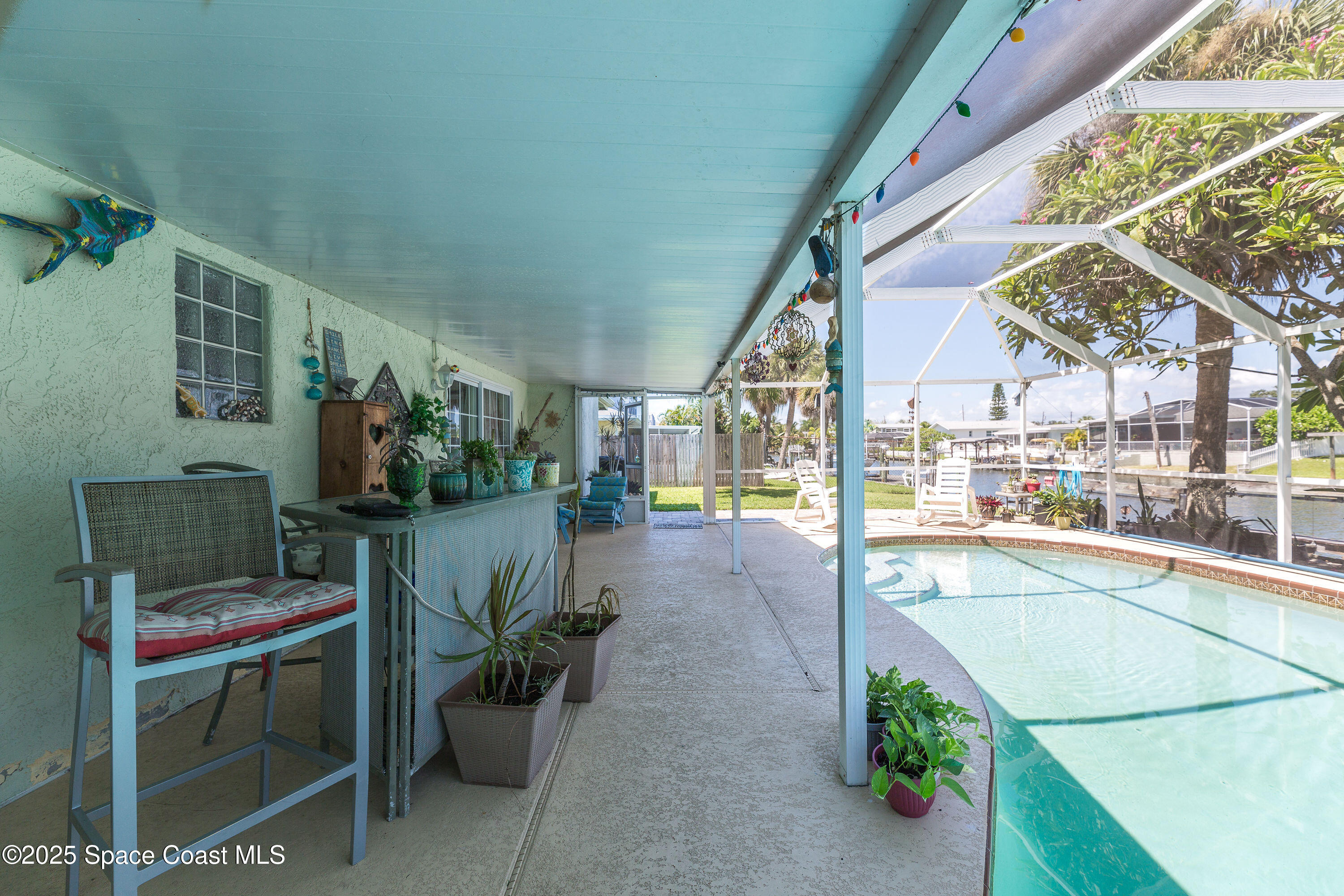 1135 Audubon Road Merritt Island, FL 32953 - Photo 28 of 52 a view of a porch with furniture