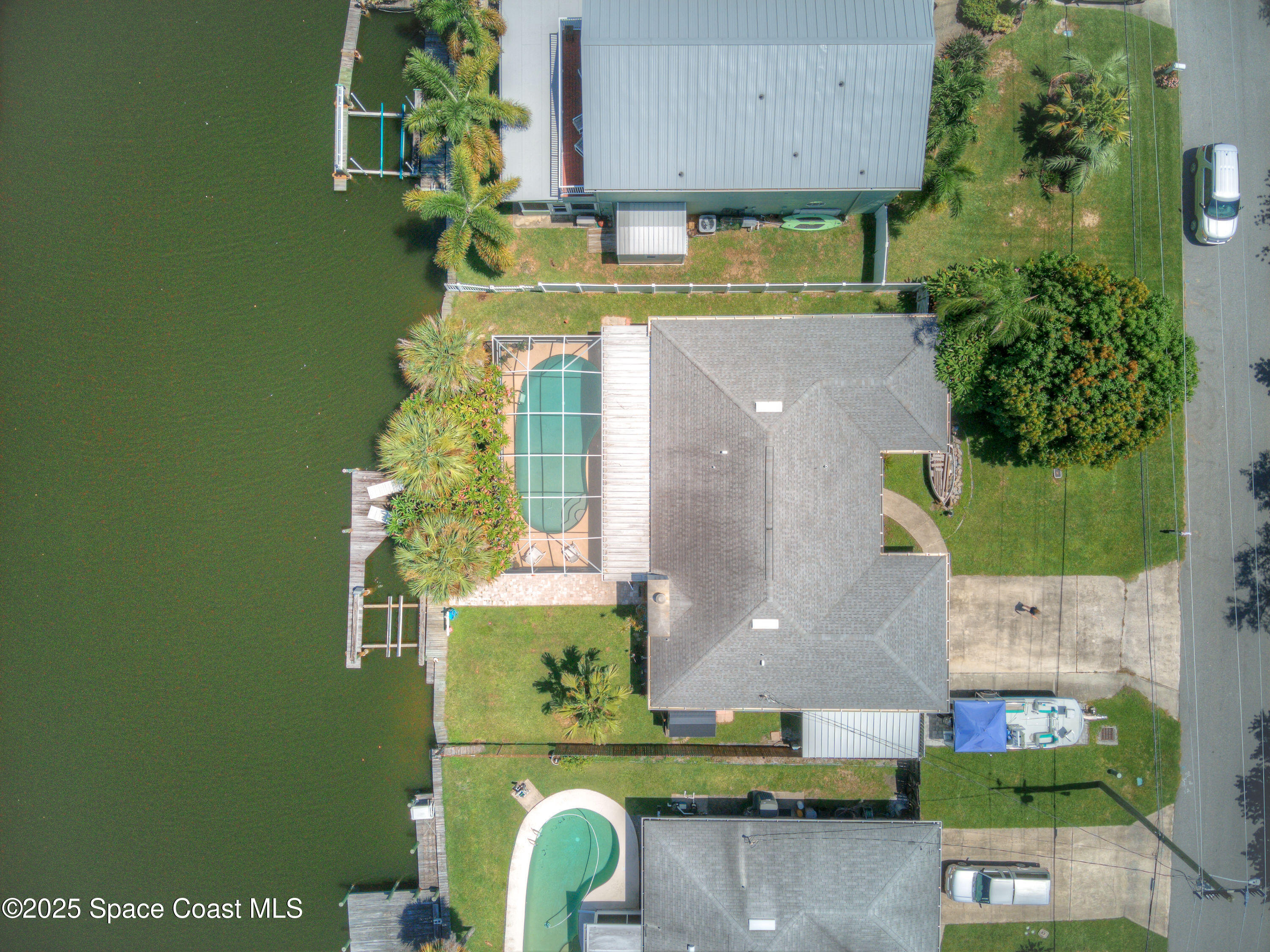1135 Audubon Road Merritt Island, FL 32953 - Photo 46 of 52 an aerial view of a house with a swimming pool