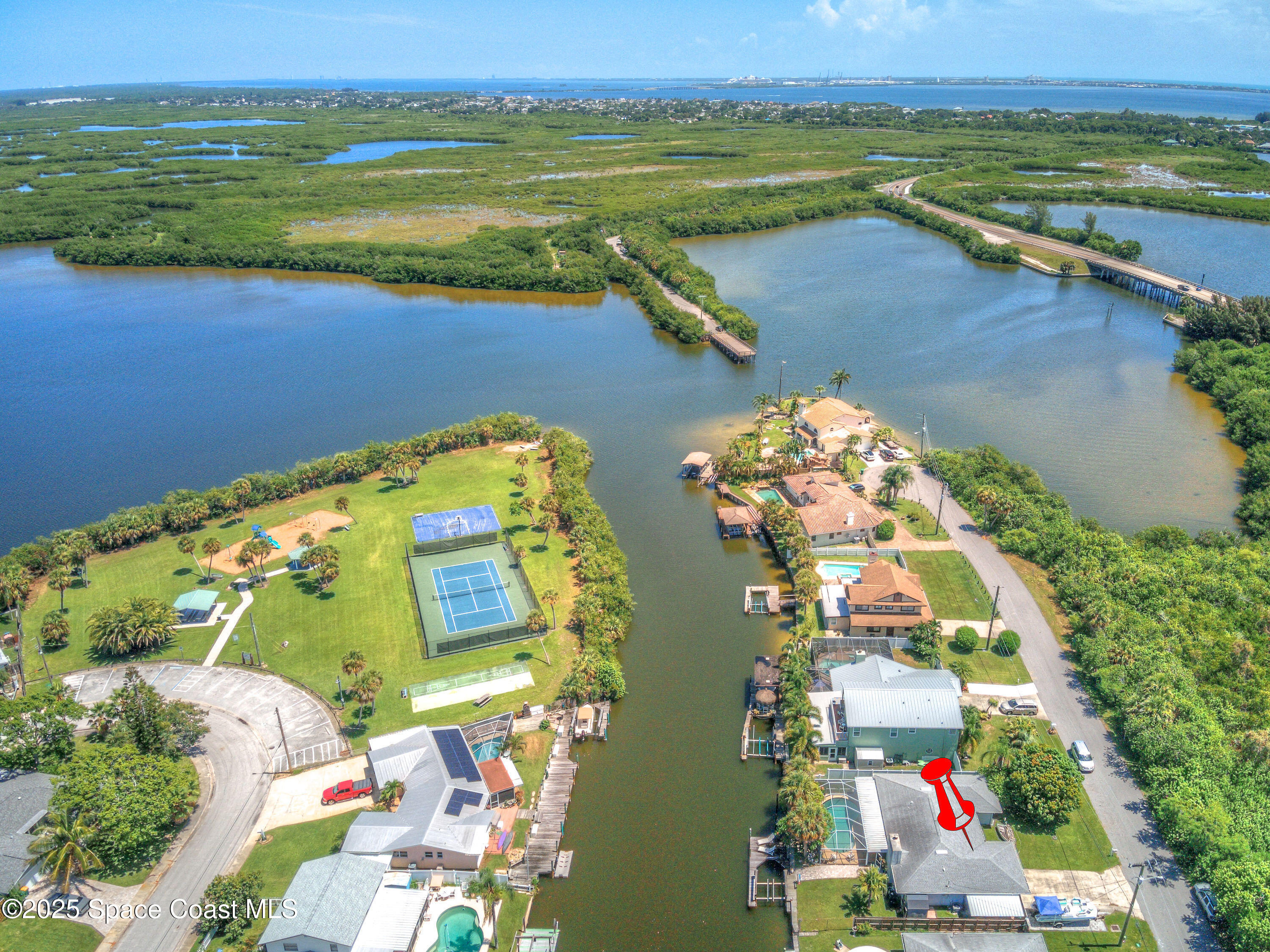 1135 Audubon Road Merritt Island, FL 32953 - Photo 5 of 52 an aerial view of residential houses with outdoor space and lake view