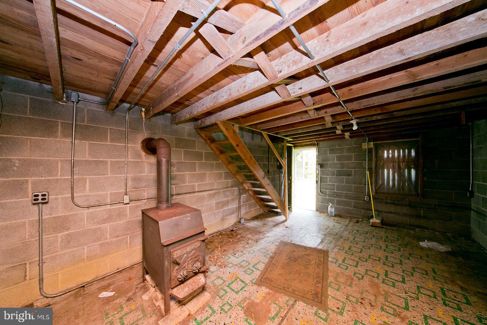 Green Spring Road Winchester, VA 22603 - Photo 14 of 27 Wood stove in cabin