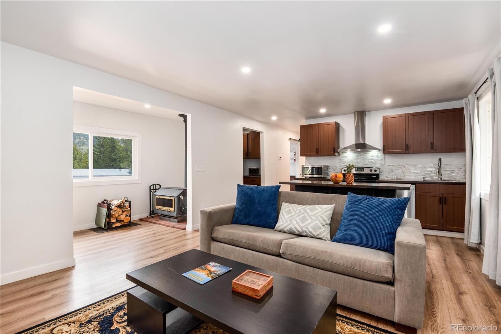 192 Little Creek Road Idaho Springs, CO 80452 - Photo 2 of 24 a living room with furniture and a wooden floor