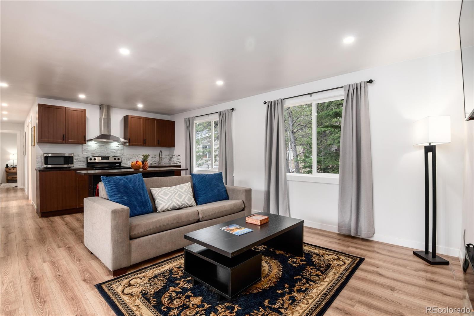 192 Little Creek Road Idaho Springs, CO 80452 - Photo 4 of 24 a living room with furniture and a wooden floor