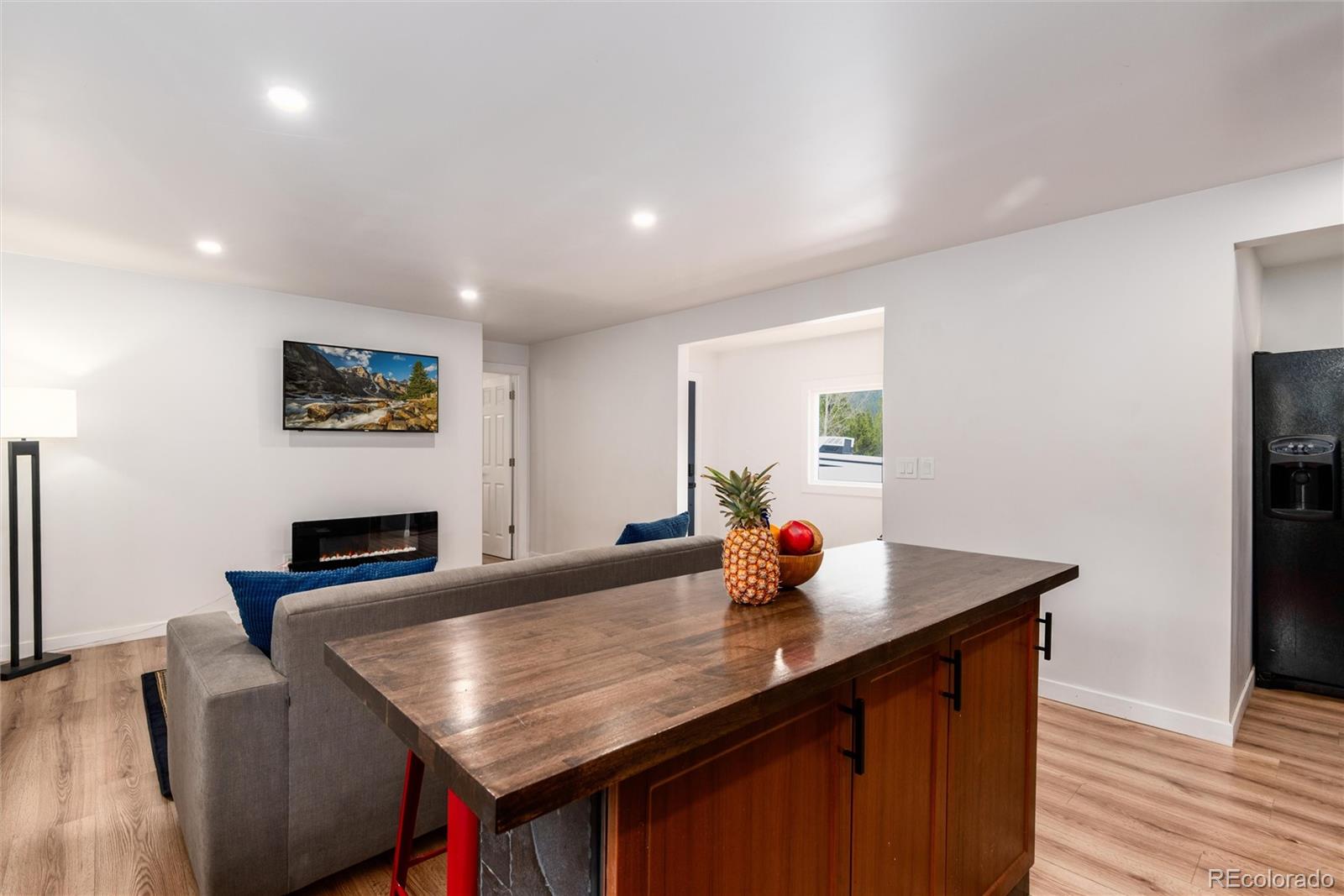 192 Little Creek Road Idaho Springs, CO 80452 - Photo 8 of 24 a kitchen with a table chairs and wooden floor