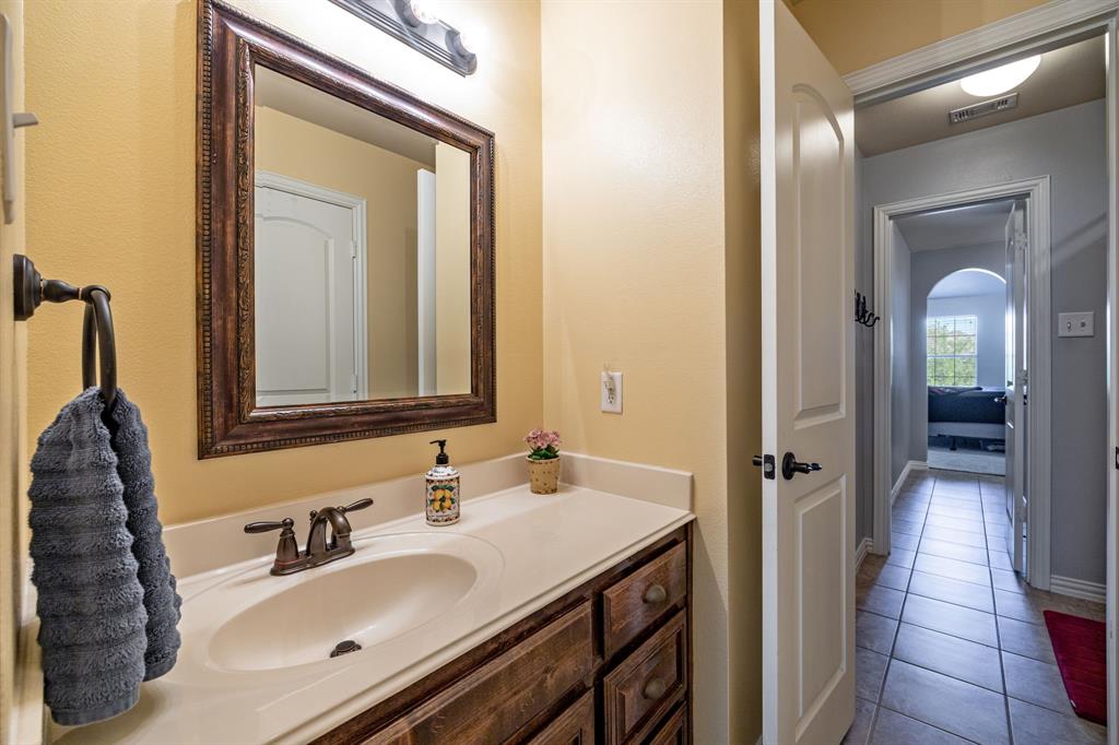 8104 Red Riv Run North Richland Hills, TX 76180 - Photo 24 of 38 a bathroom with a sink vanity and a mirror