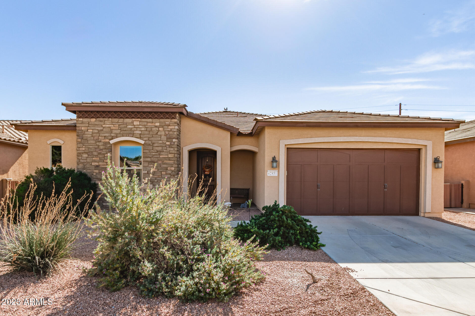 42851 West Mallard Road Maricopa, AZ 85138 - Photo 1 of 45 a front view of a house with garden