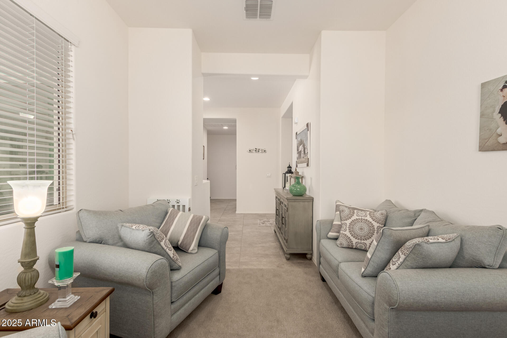 42851 West Mallard Road Maricopa, AZ 85138 - Photo 14 of 45 a living room with furniture and a large window