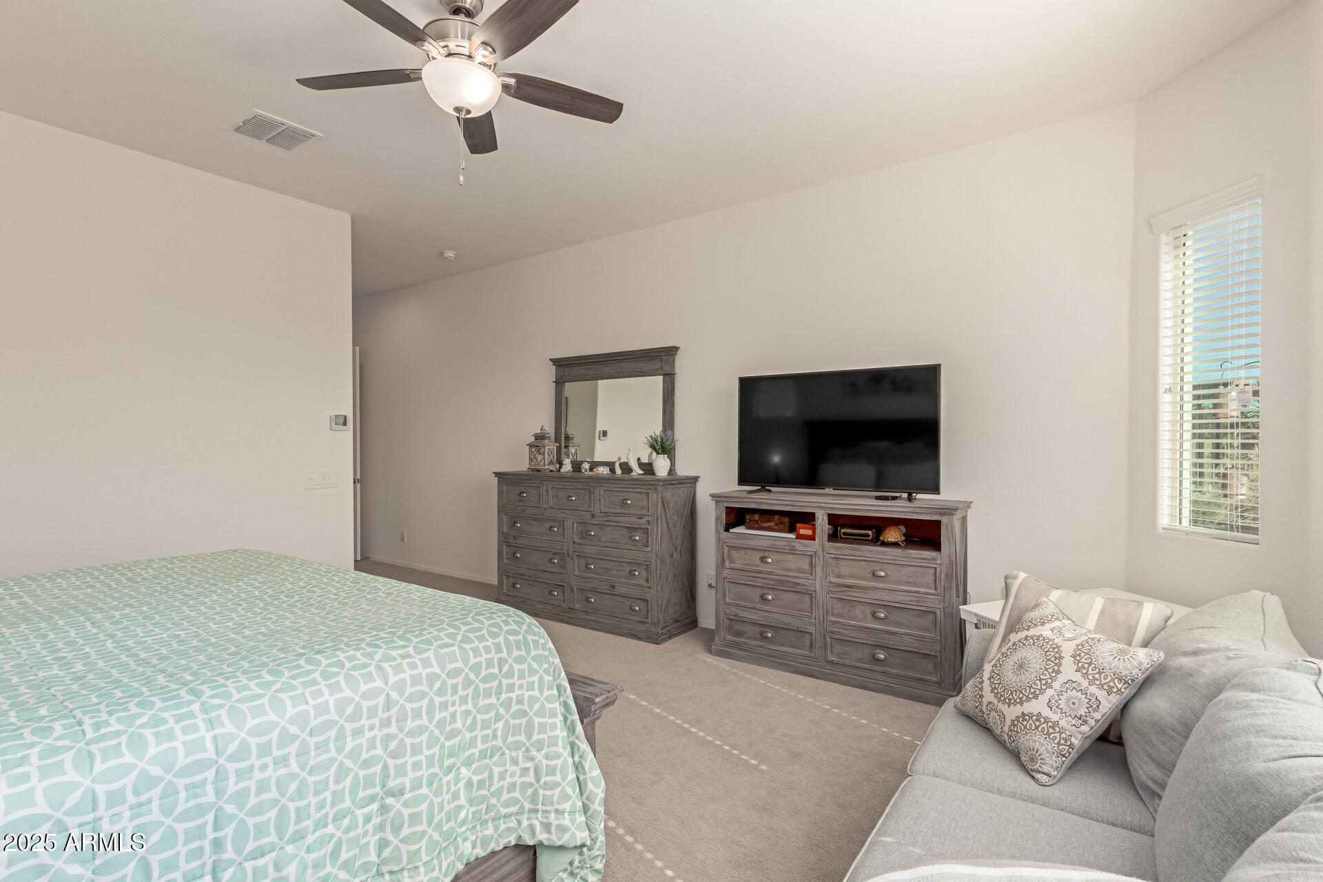 42851 West Mallard Road Maricopa, AZ 85138 - Photo 24 of 45 a bedroom with a bed and a flat screen tv