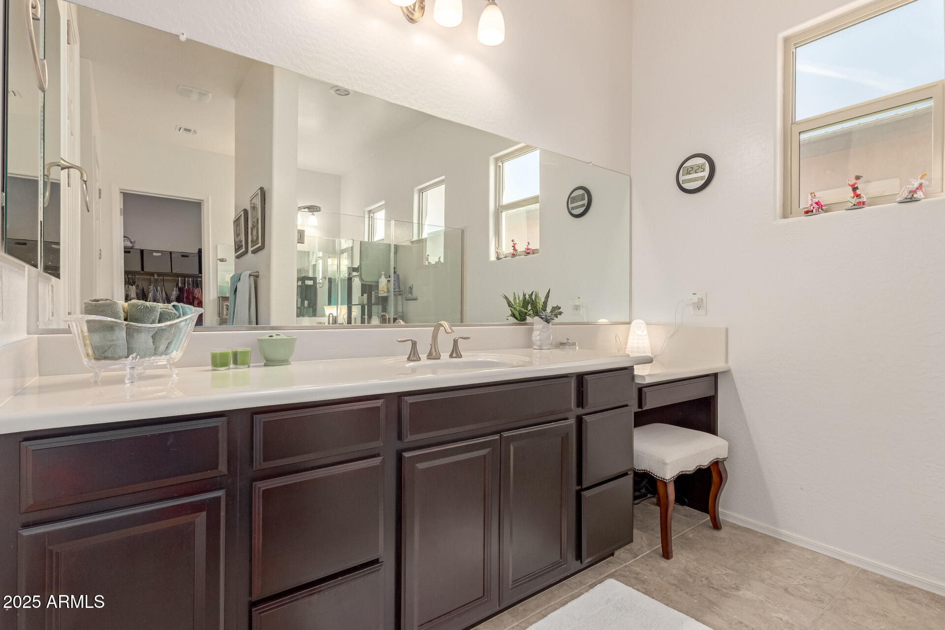 42851 West Mallard Road Maricopa, AZ 85138 - Photo 25 of 45 a bathroom with a sink and a mirror