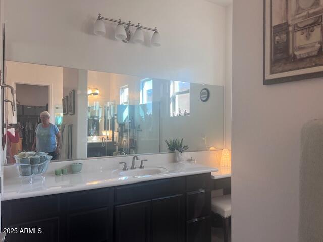 42851 West Mallard Road Maricopa, AZ 85138 - Photo 26 of 45 a bathroom with a double vanity sink and a mirror