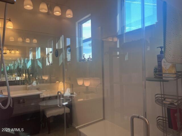 42851 West Mallard Road Maricopa, AZ 85138 - Photo 28 of 45 a bathroom with a toilet a sink and mirror