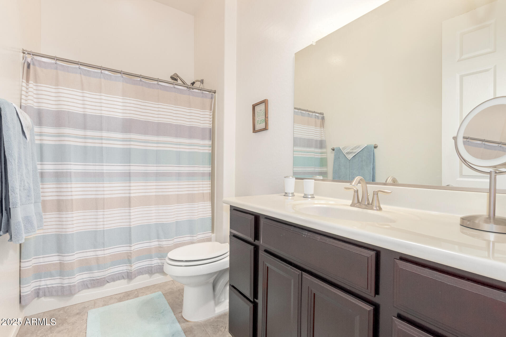 42851 West Mallard Road Maricopa, AZ 85138 - Photo 34 of 45 a bathroom with a sink a toilet and shower
