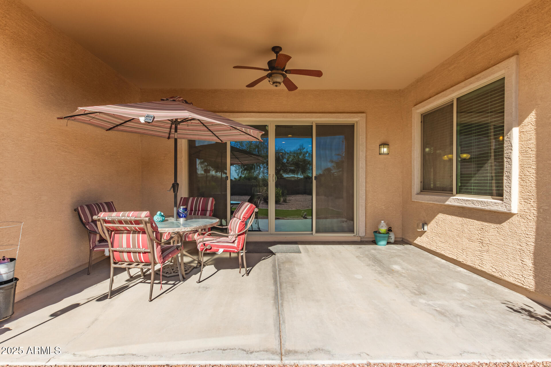 42851 West Mallard Road Maricopa, AZ 85138 - Photo 36 of 45 a backyard of a house with table and chairs