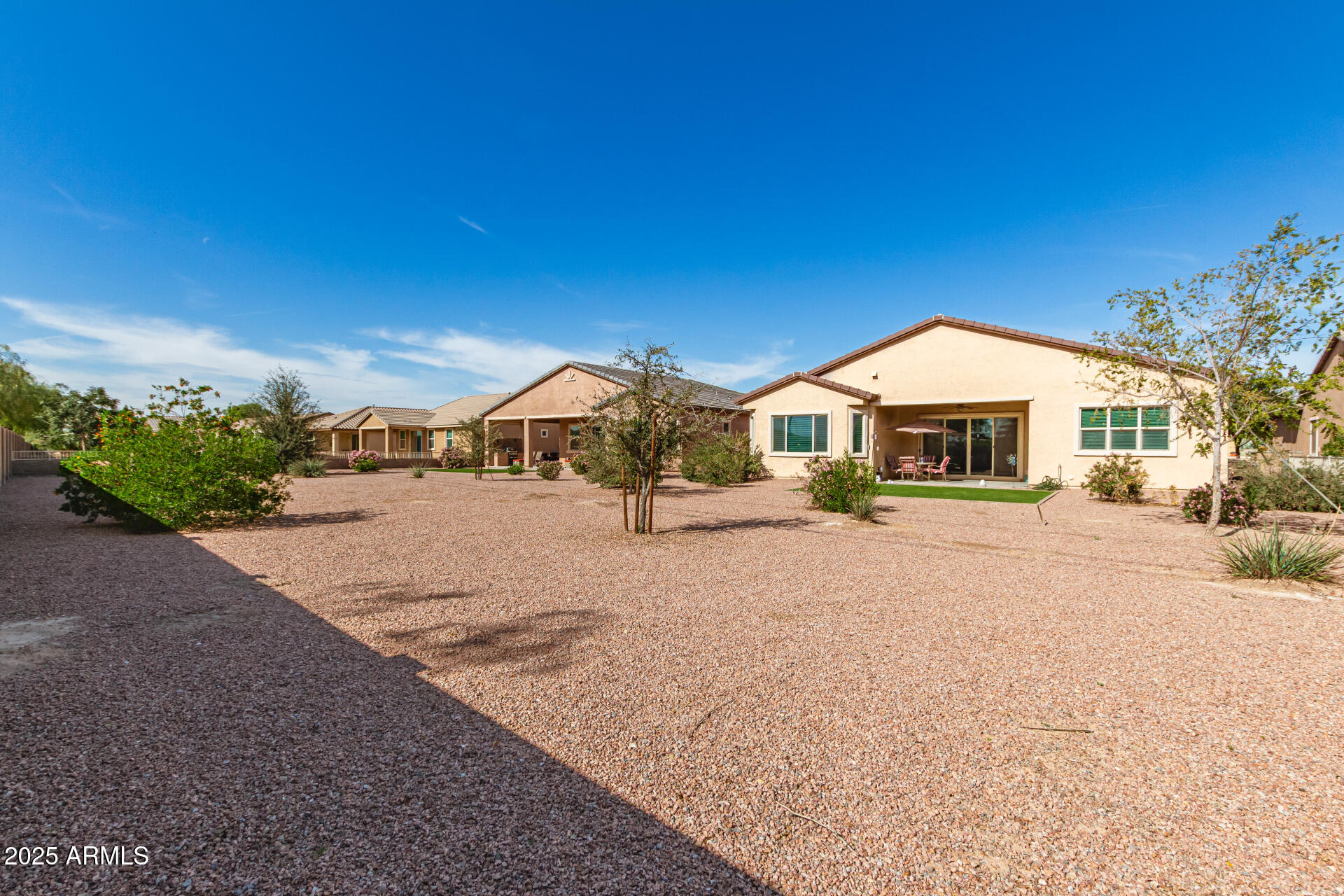 42851 West Mallard Road Maricopa, AZ 85138 - Photo 41 of 45 a front view of a house with a yard and garage
