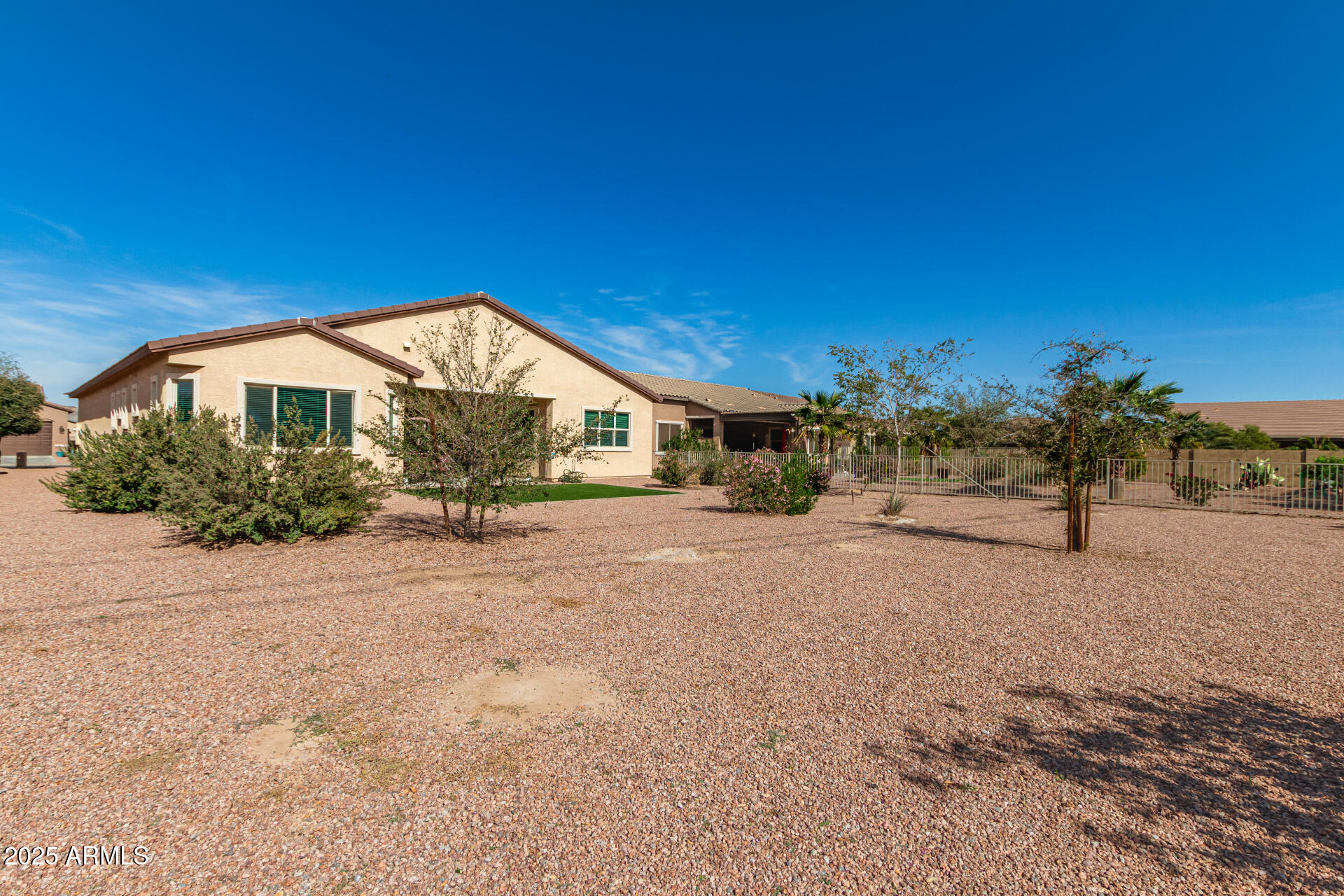 42851 West Mallard Road Maricopa, AZ 85138 - Photo 42 of 45 a view of a house with a yard and covered with trees