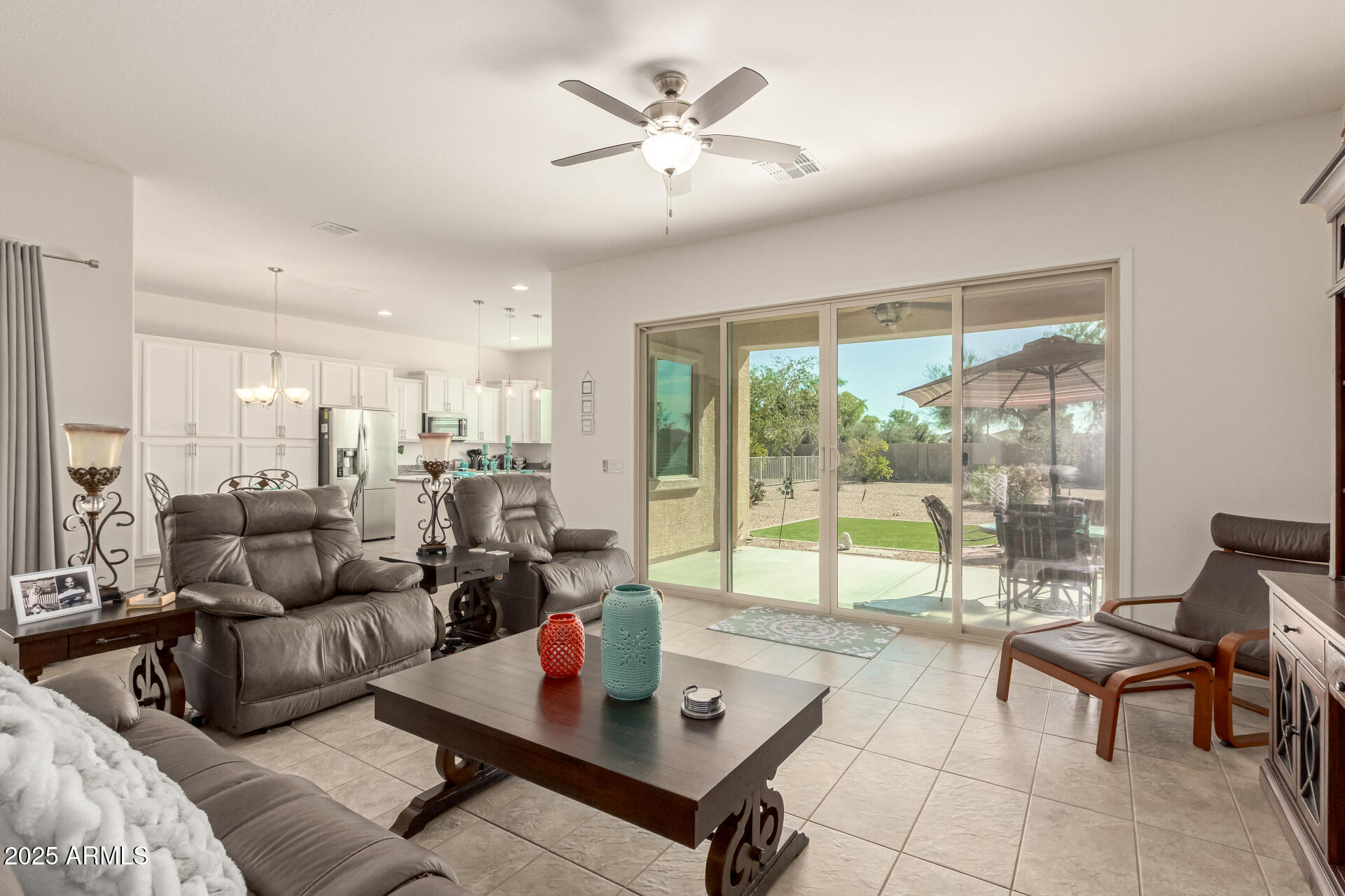42851 West Mallard Road Maricopa, AZ 85138 - Photo 9 of 45 a living room with furniture and large windows