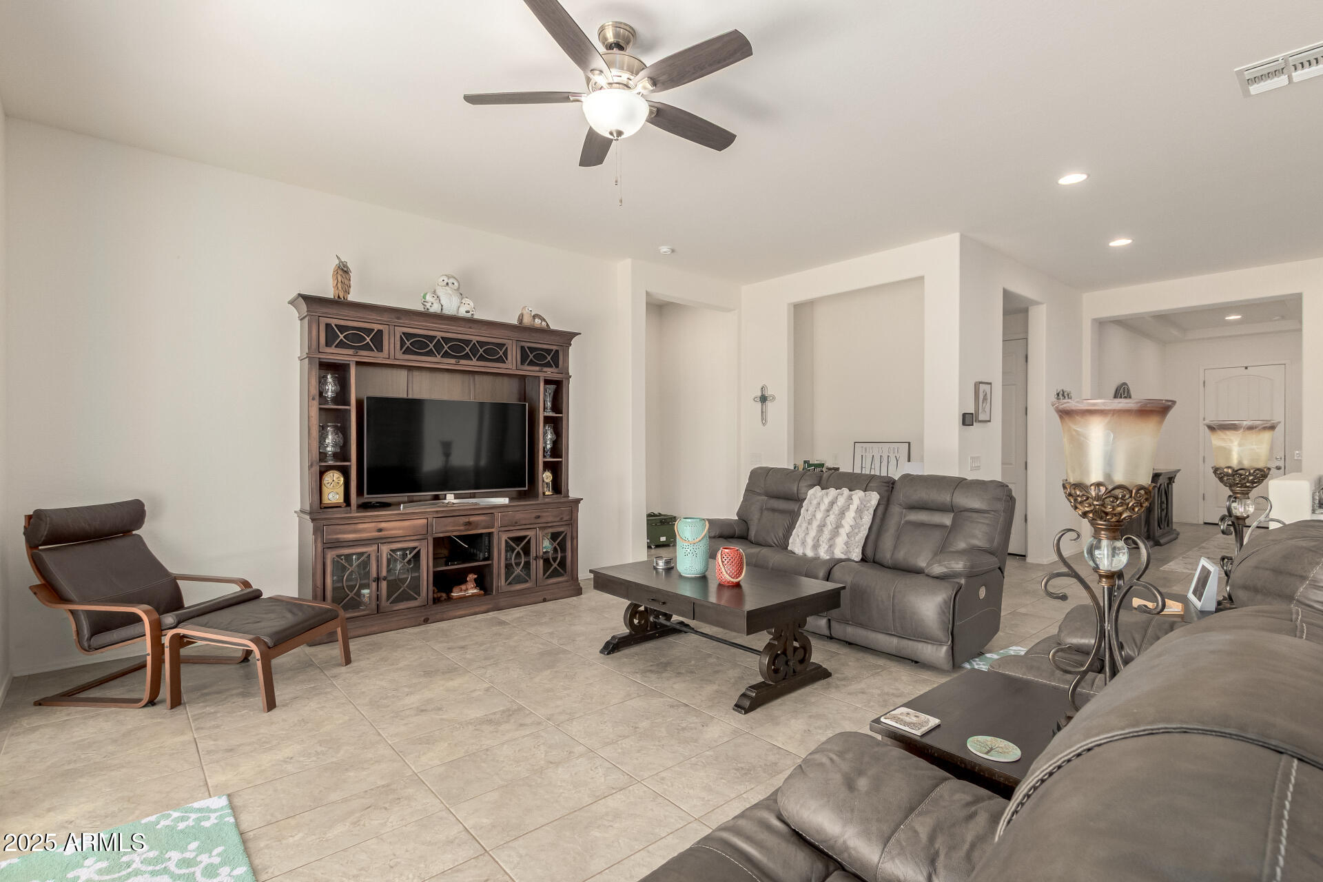 42851 West Mallard Road Maricopa, AZ 85138 - Photo 10 of 45 a living room with furniture and a flat screen tv