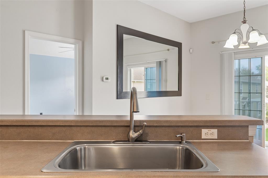 3555 Clay Brick Road, Unit 46A Harmony, FL 34773 - Photo 12 of 54 a kitchen with a sink and a mirror