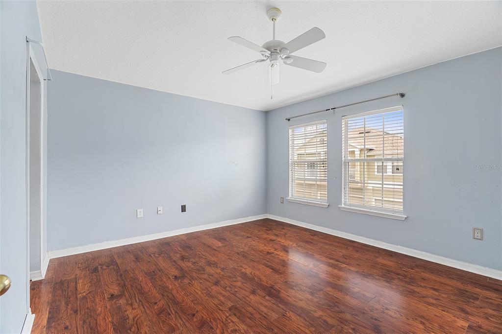 3555 Clay Brick Road, Unit 46A Harmony, FL 34773 - Photo 13 of 54 a view of an empty room with wooden floor and a window