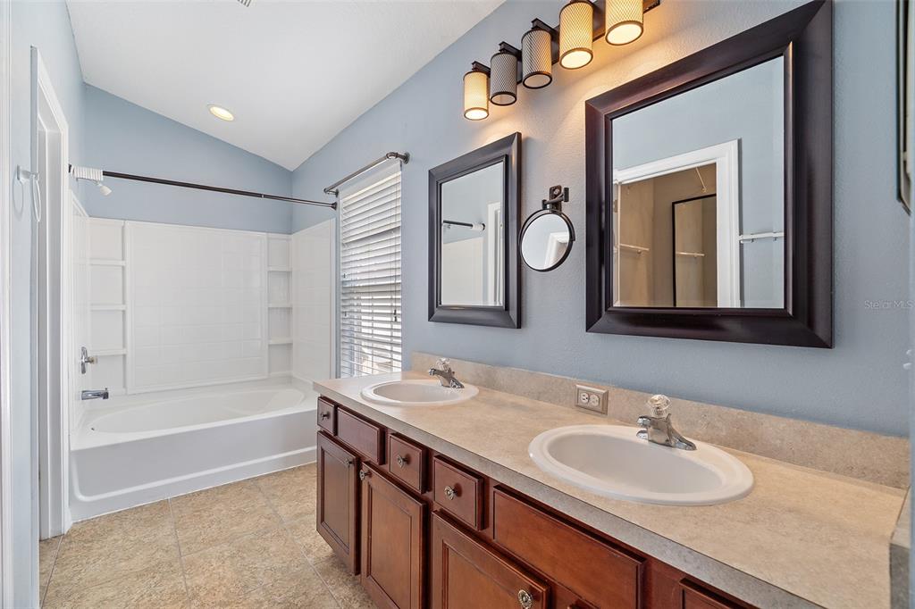 3555 Clay Brick Road, Unit 46A Harmony, FL 34773 - Photo 16 of 54 a bathroom with 2 sink and a mirror