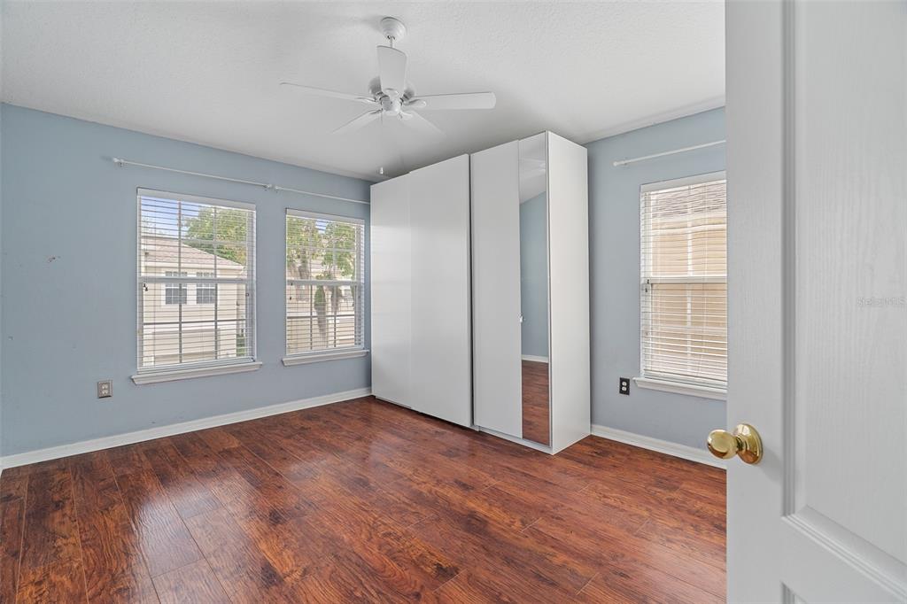 3555 Clay Brick Road, Unit 46A Harmony, FL 34773 - Photo 19 of 54 a view of an empty room with a window and wooden floor
