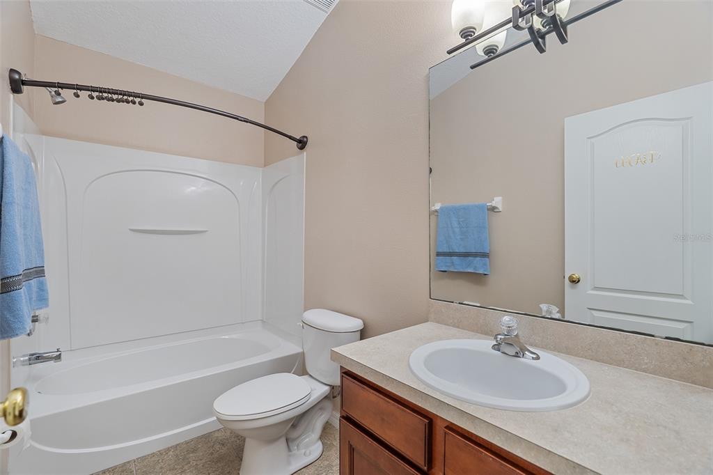 3555 Clay Brick Road, Unit 46A Harmony, FL 34773 - Photo 21 of 54 a bathroom with a sink toilet and shower